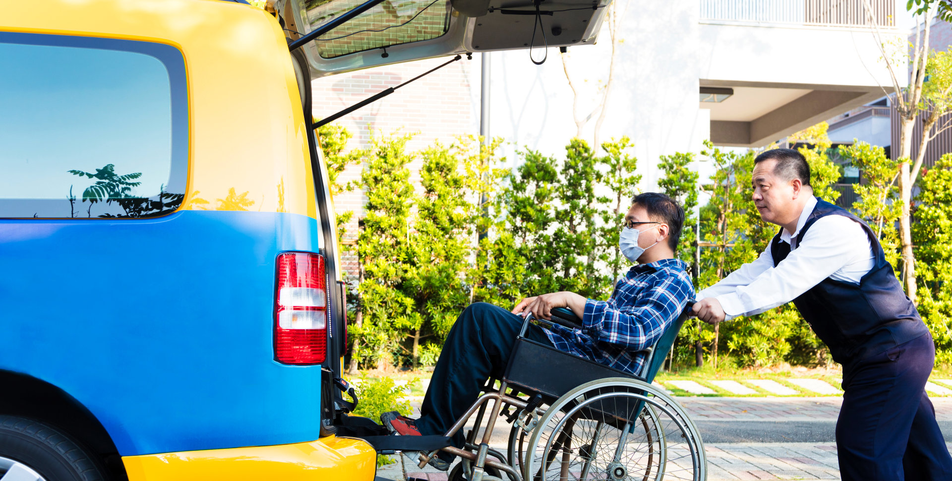 man assist the man in the wheelchair