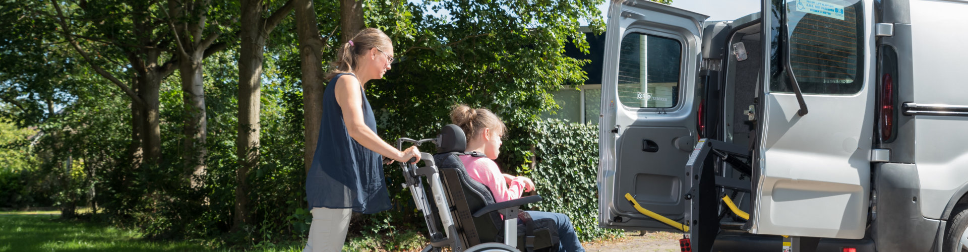 daughter assist her daughter in going up to the van